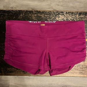 NWT Lucy purple shorts w/ gathered sides. Size medium.